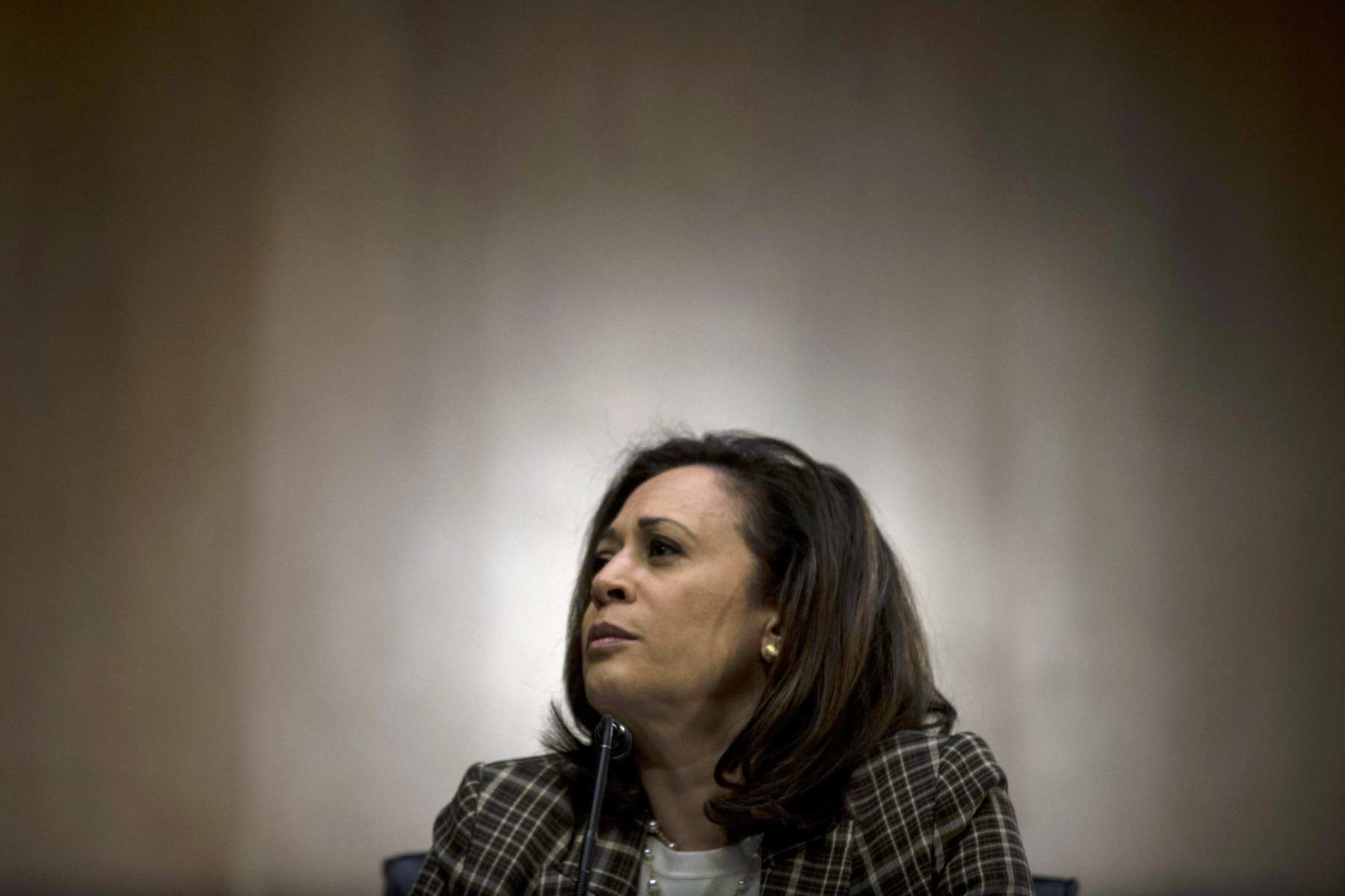 Kamala Harris against a solid background.