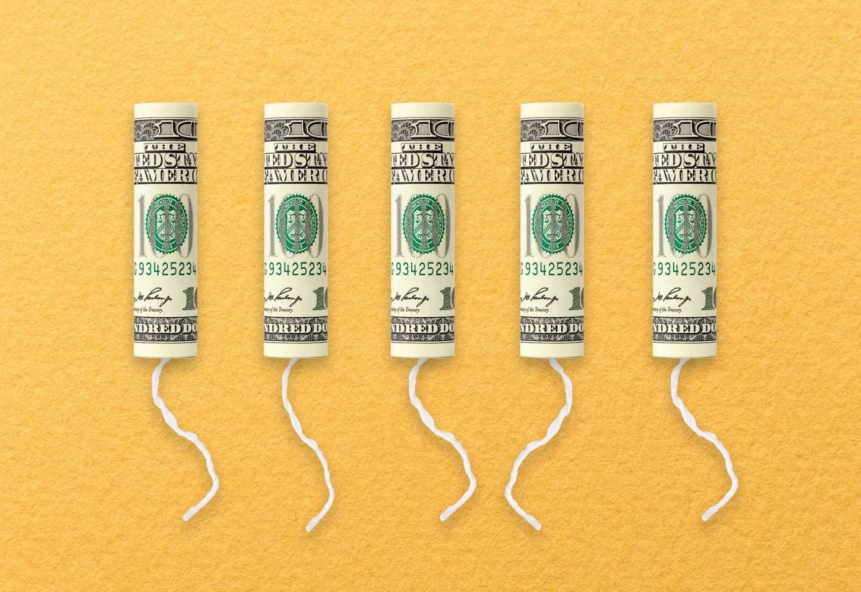 A row of tampons with $100 bills on them.