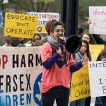 A person with a megaphone at a protest.