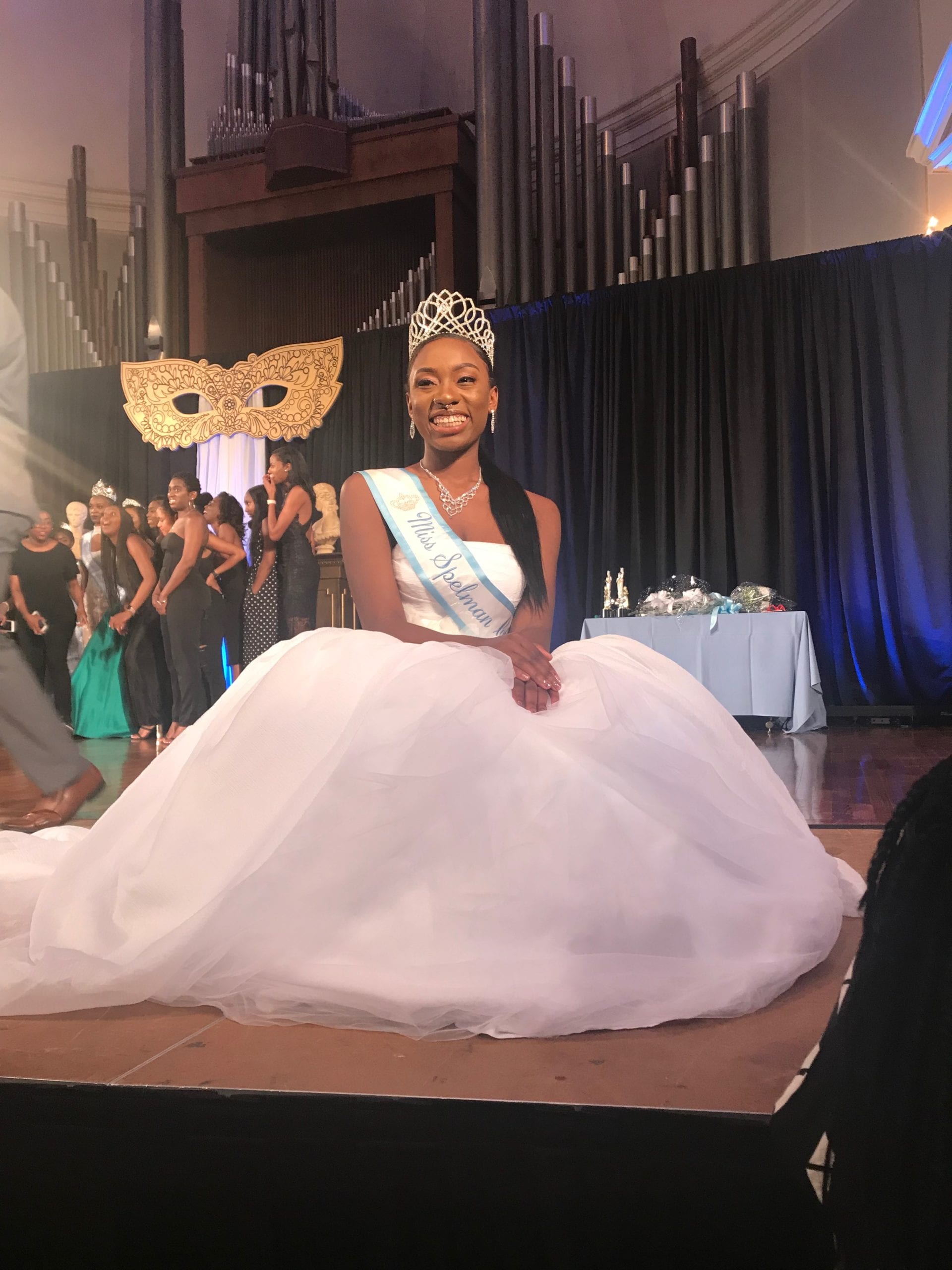 Eva Dickerson in a ball gown, wearing a crown and sash.