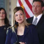 Barbara Lagoa, center, Governor Ron DeSantis' pick for the Florida Supreme Court, speaks after being introduced, as DeSantis and Lieutenant Governor Jeanette Nunez, left, look on, Wednesday, Jan. 9, 2019, in Miami. (AP Photo/Wilfredo Lee)