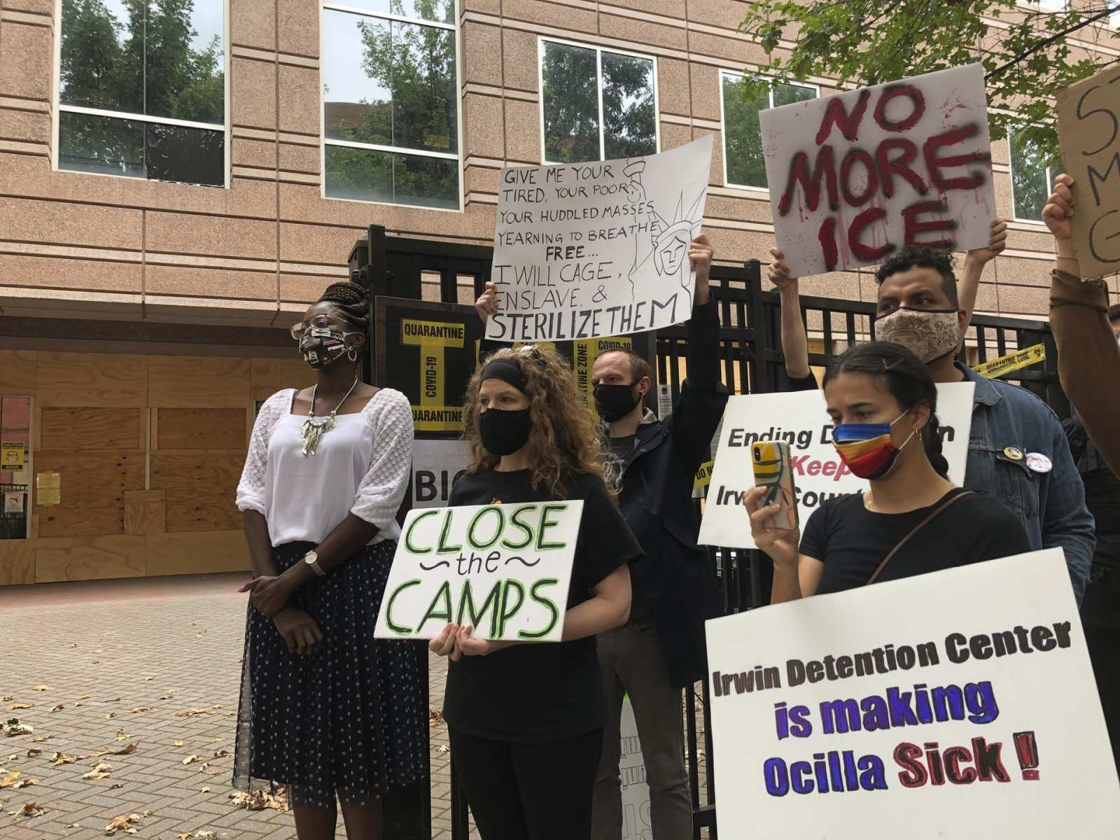 Dawn Wooten, left, a nurse at Irwin County Detention Center in Ocilla, Georgia, speaks at a Tuesday, Sept. 15, 2020 news conference in Atlanta protesting conditions at the immigration jail. Wooten says authorities denied COVID-19 tests to immigrants, performed questionable hysterectomies and shredded records in a complaint filed to the inspector general of the U.S. Department of Homeland Security. (AP Photo/Jeff Amy)