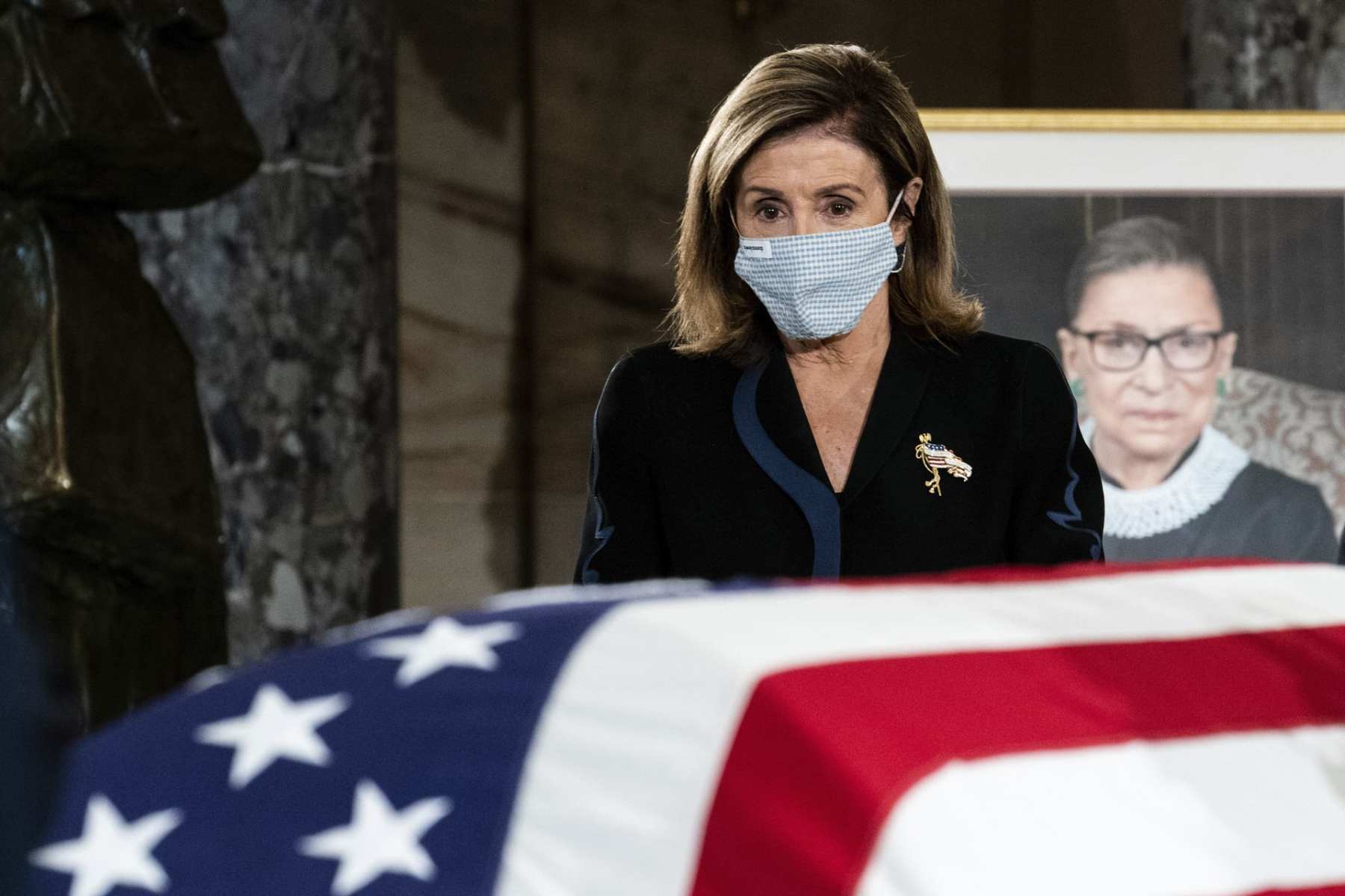 House Speaker Nancy Pelosi pays her respects to Justice Ruth Bader Ginsburg as she lies in state in the U.S. Capitol on Friday, Sept. 25, 2020. Ginsburg died at the age of 87 on Sept. 18 and is the first women to lie in state at the Capitol.