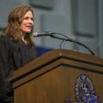 Amy Coney Barrett gives a speech at a podium.