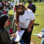 Sandra Amado Gomez and her daughter Aylen Agostina Gomez registers a woman to vote during halftime at the championship game of soccer on Sunday, Sept. 20, 2020 in Raleigh, NC. North Carolina is gearing up to be a swing state in the 2020 election and Latino voters will play a big part in the outcome.