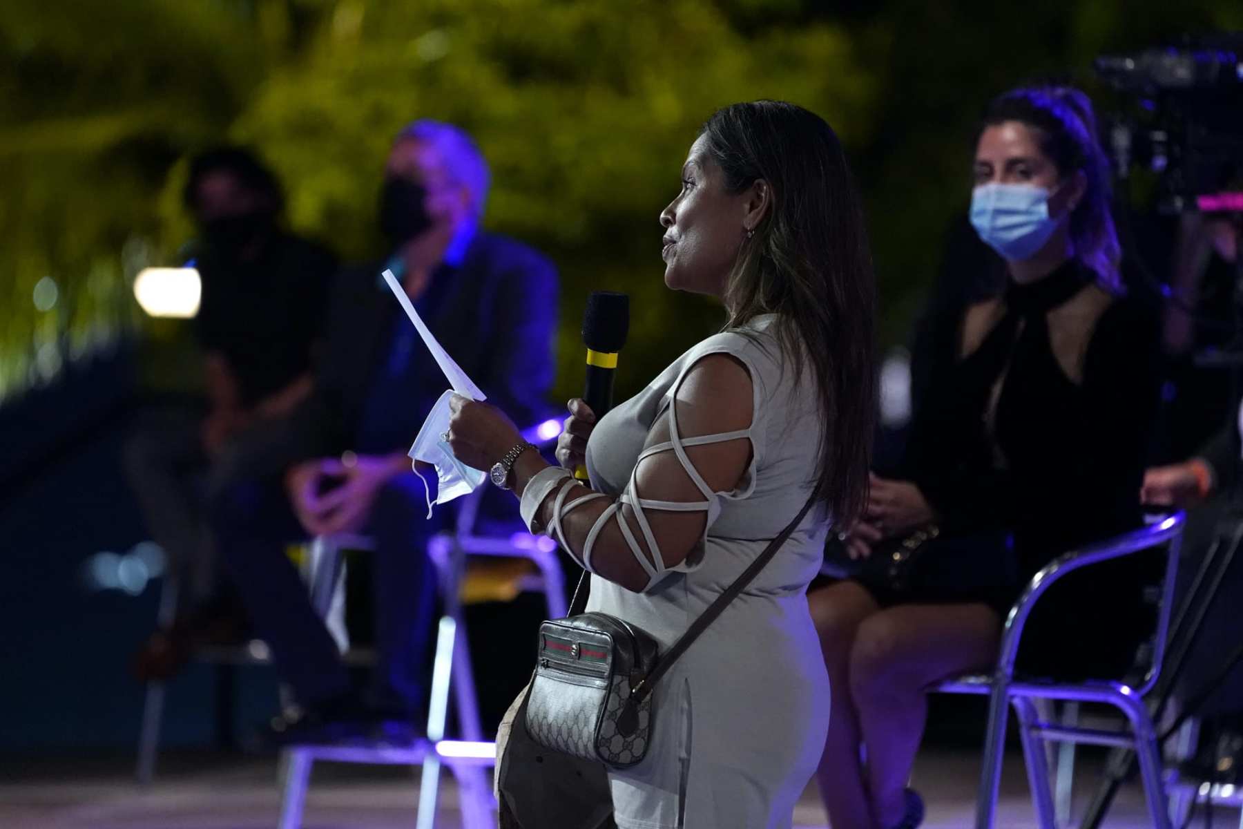 A woman asks a question at Donald Trump's town hall in Miami.