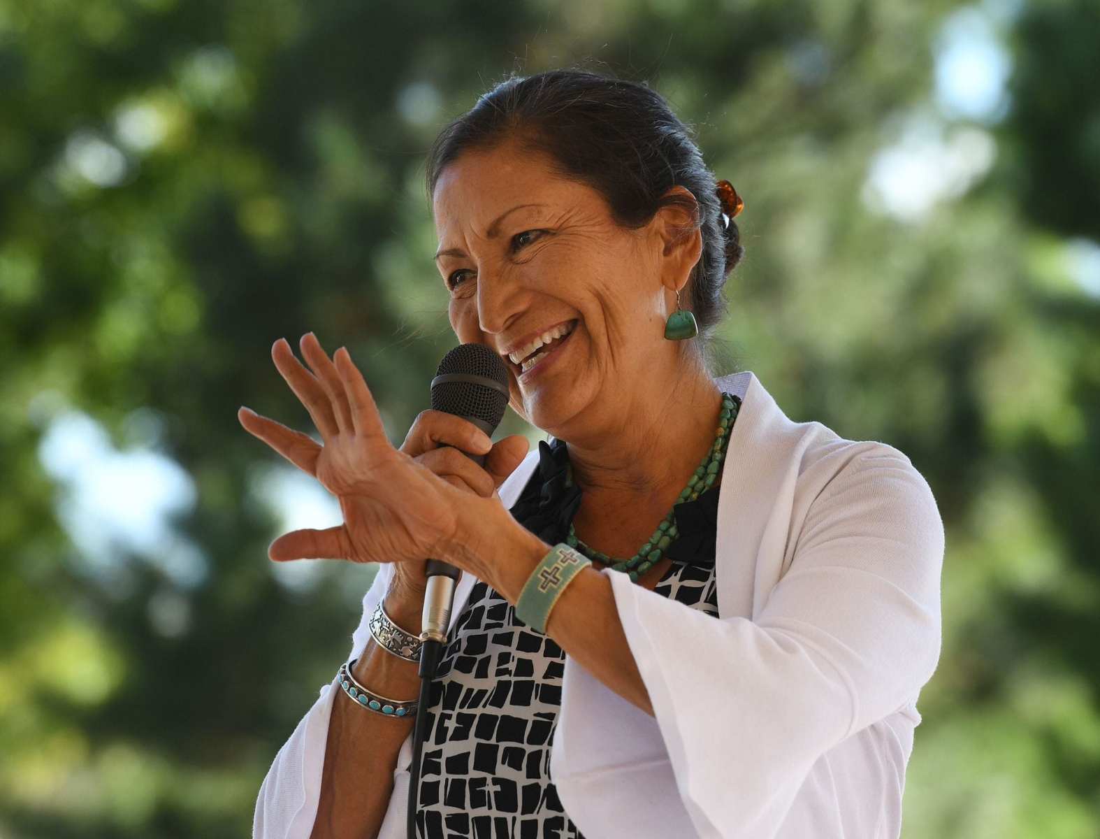 Deb Haaland, one of the first Native Americans in Congress, waves.