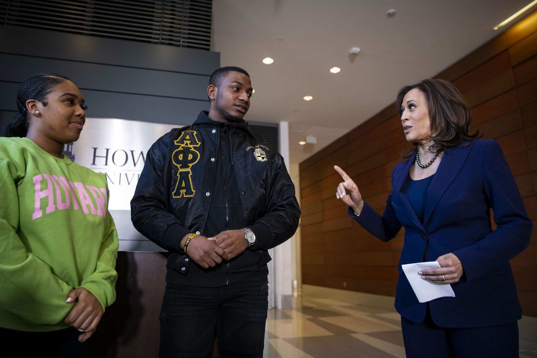 Kamala Harris speaking to two students at Howard University.