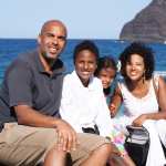 A family sits on a beach