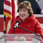 Susan Collins speaks at a podium.