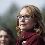 Former Rep. Gabby Giffords listens to lawmakers.