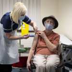 A woman receives the Oxford-AstraZeneca Covid-19 vaccine.