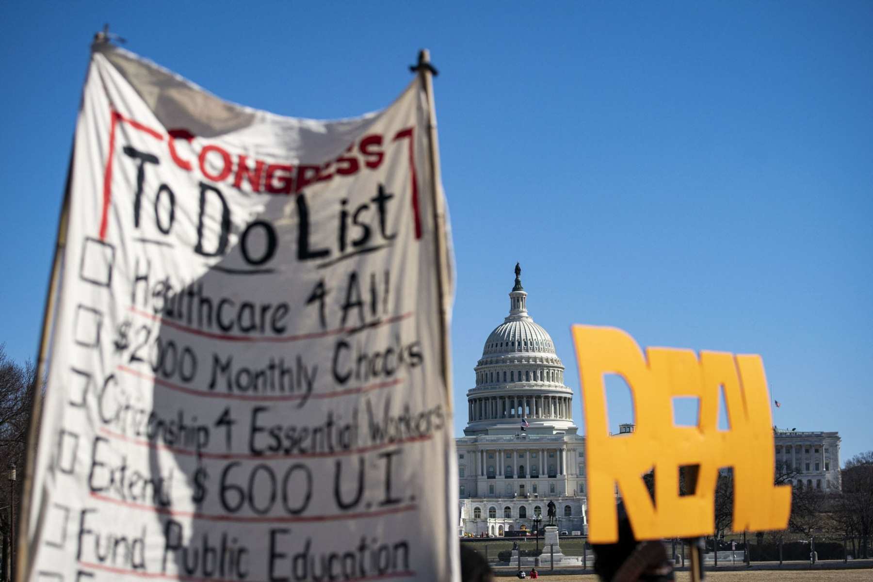 Signs at the Capitol in support of the relief bill