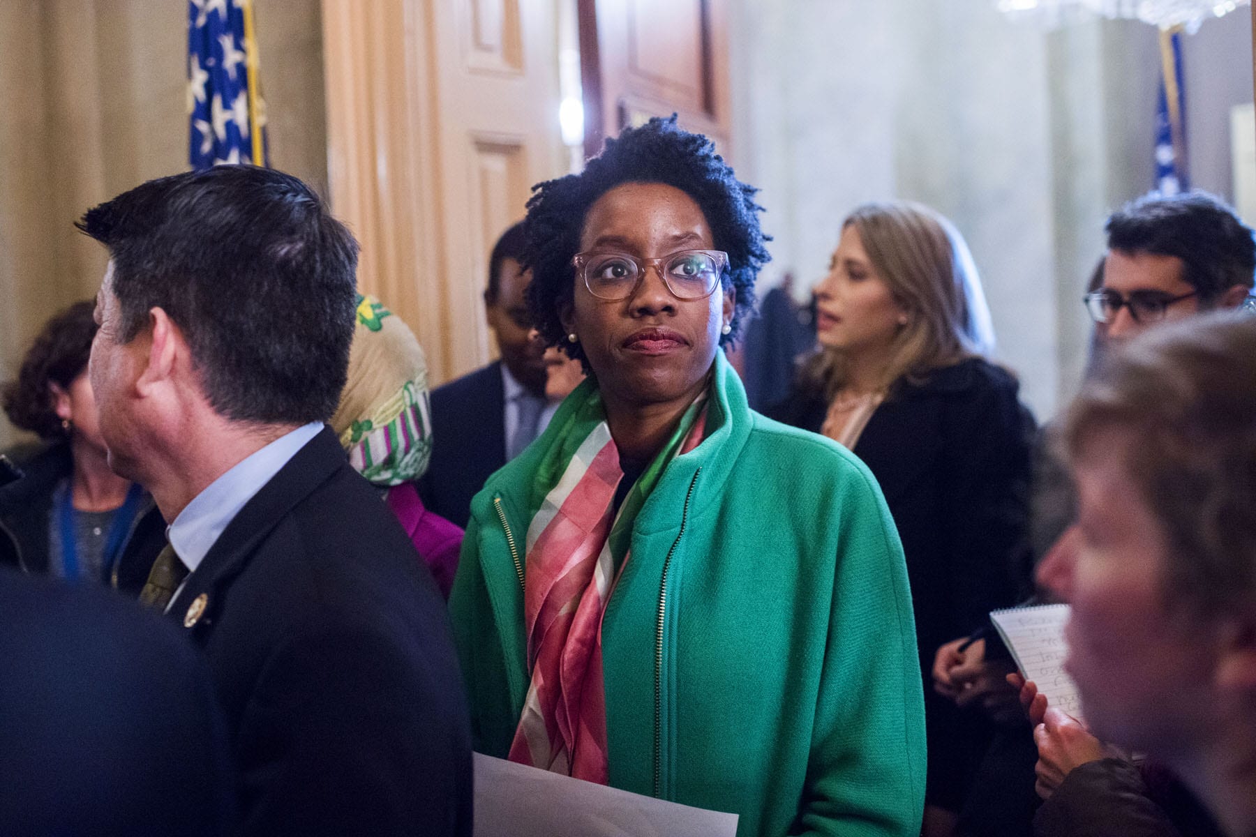 Rep. Lauren Underwood stands in the hallway at the Capitol.