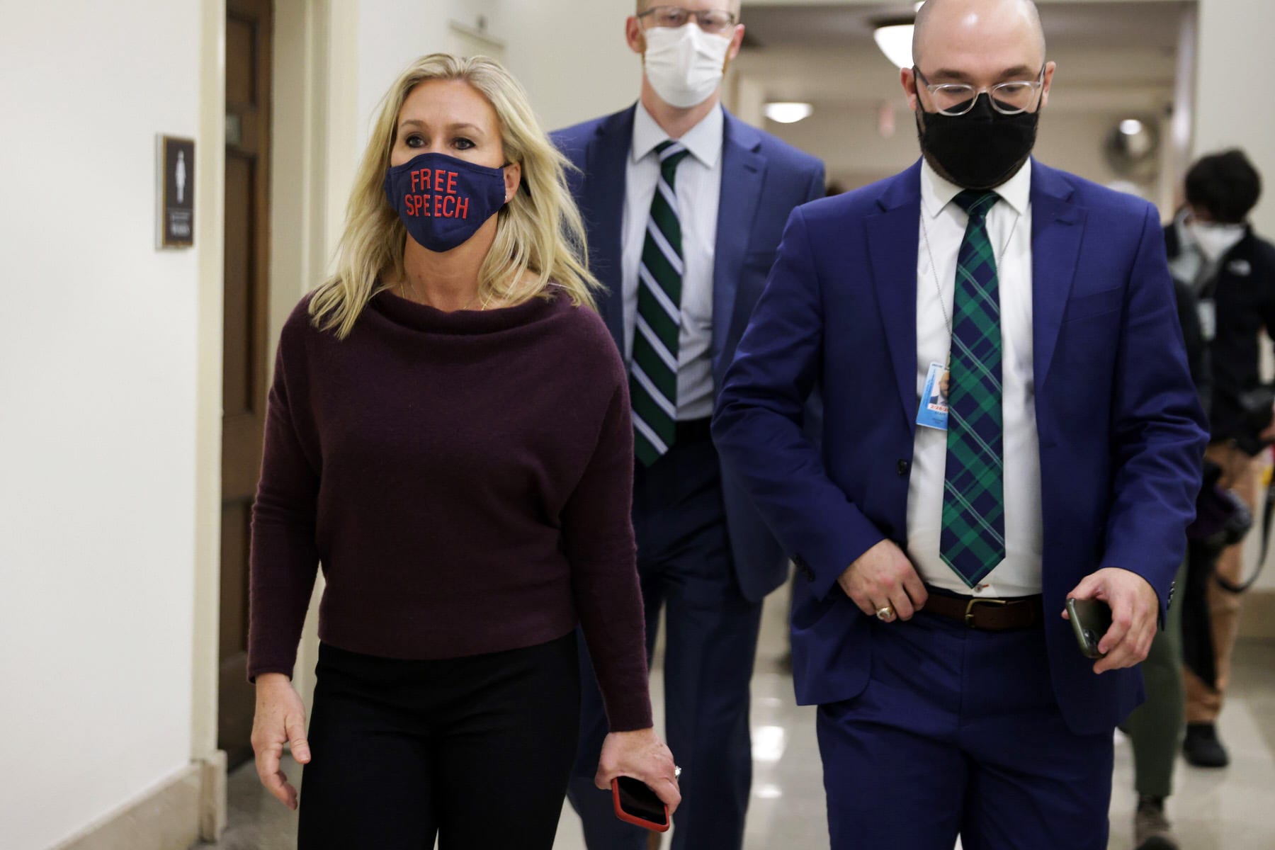 U.S. Rep. Marjorie Taylor Greene (R-GA) leaves her office walking with a group of people.