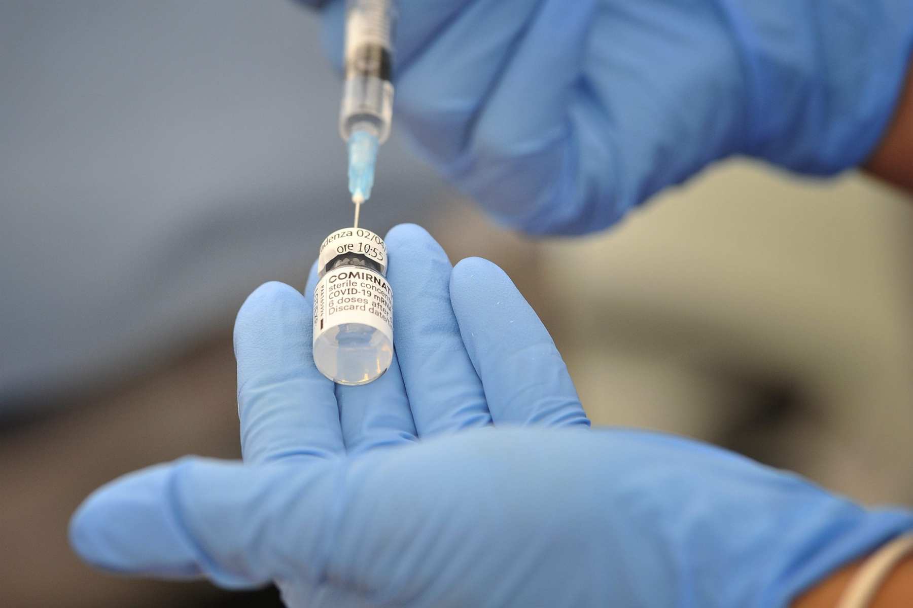 Nurse prepares a dose of Pfizer vaccine to be administered to patients.