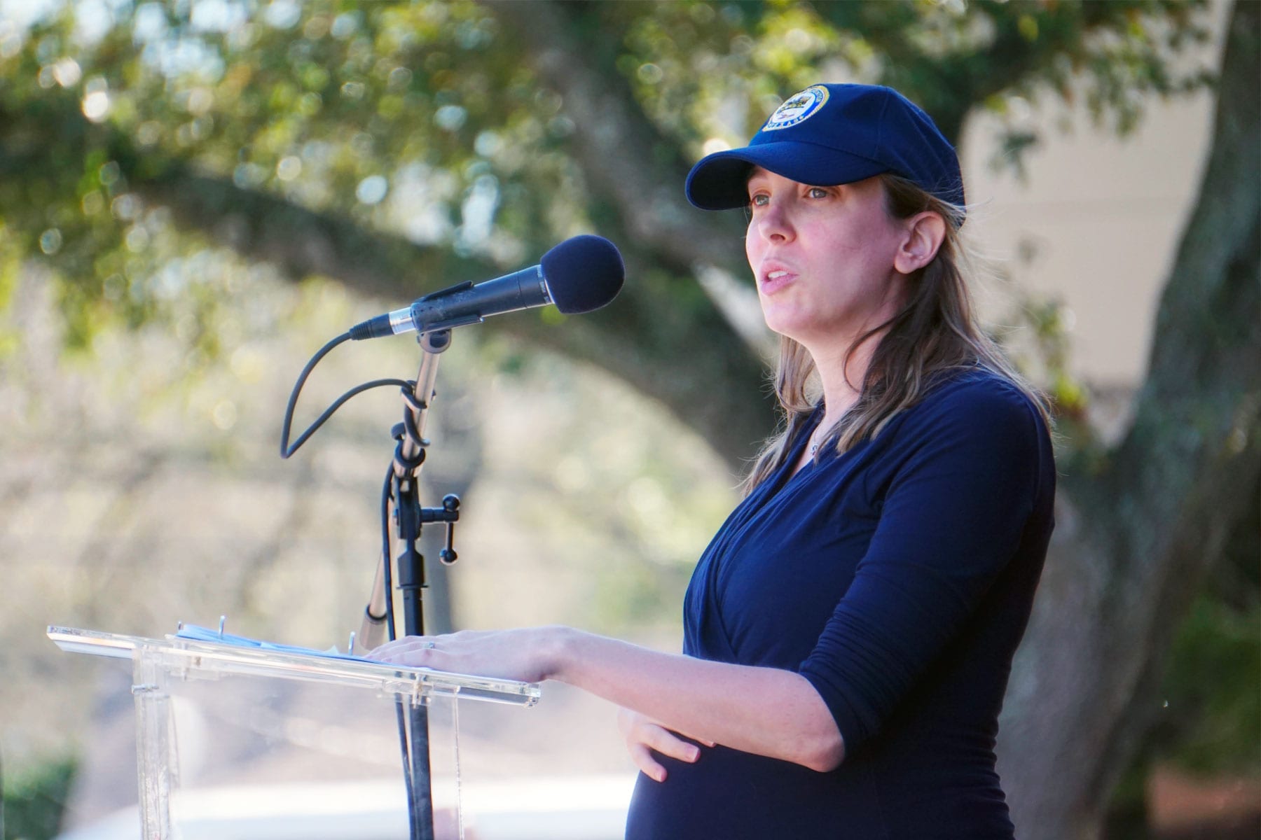 Houston council member Abbie Kamin speaking from a lectern.