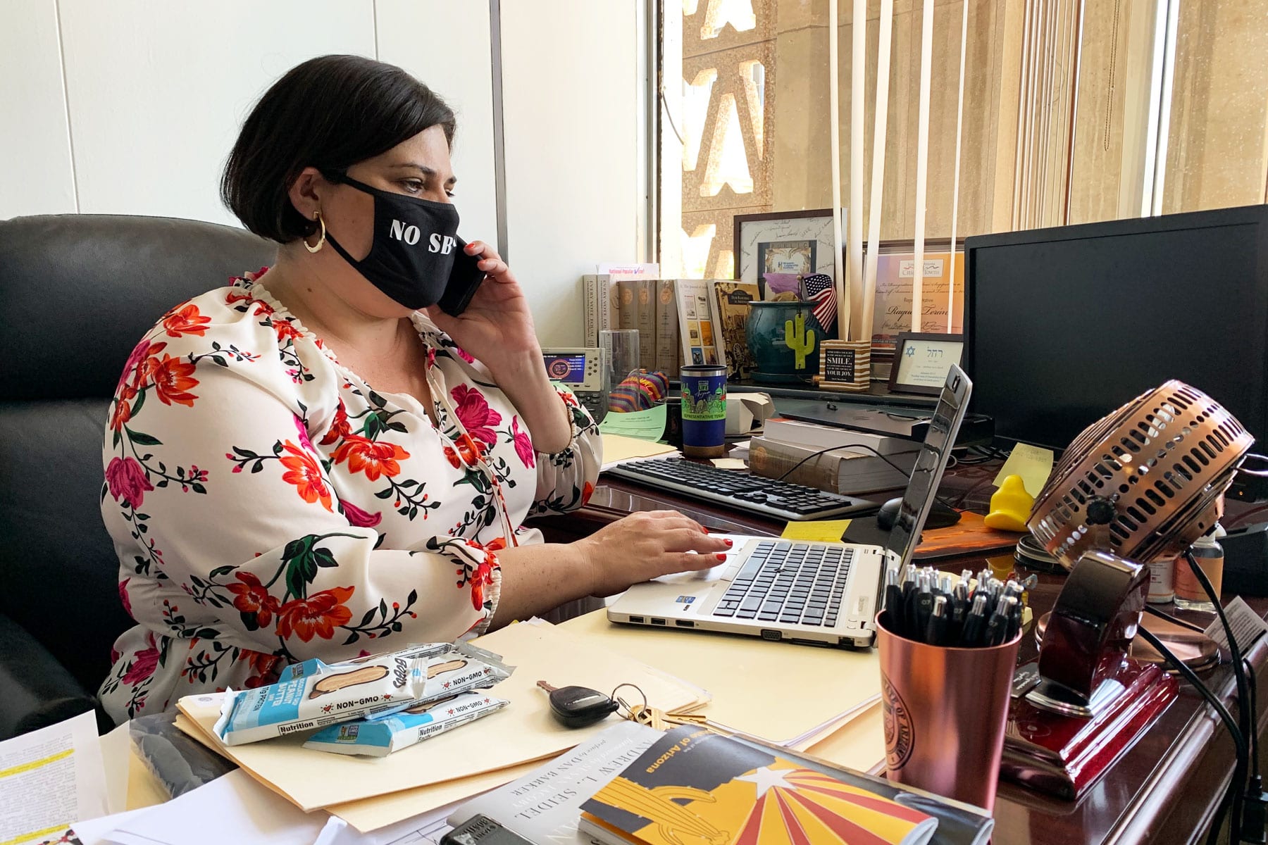 Arizona state Rep. Raquel Terán working at her desk.