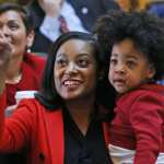 Jennifer Carroll Foy holds her baby on the floor of the Virginia House.