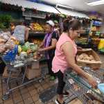 People shopping at a food bank.