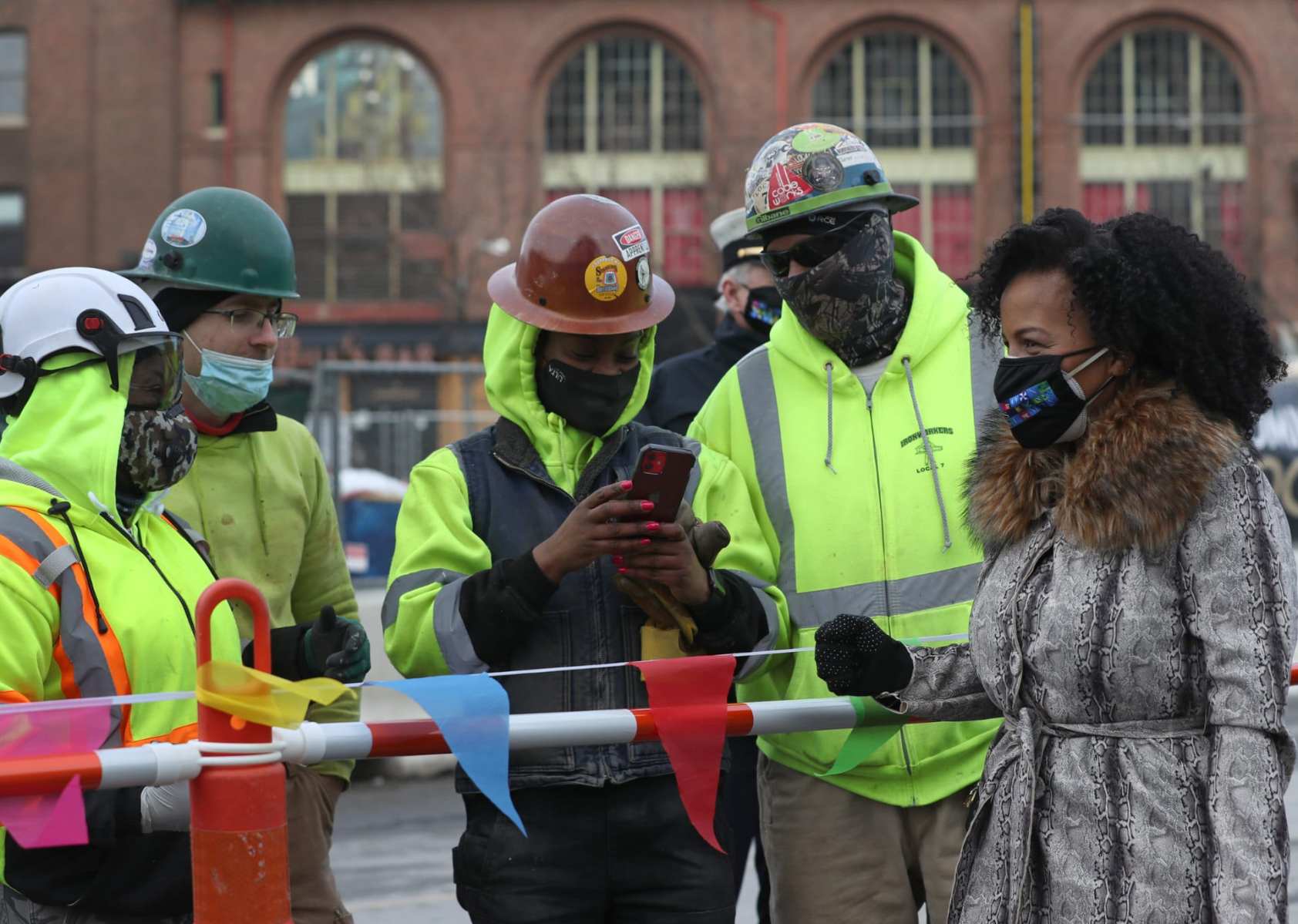 Kim Janey with construction workers in Boston