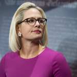 Sen. Kyrsten Sinema, D-Ariz., conducts a news conference.