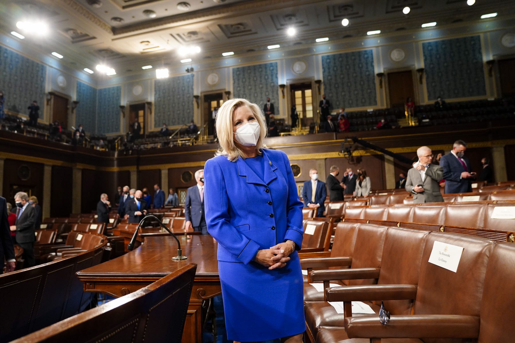 Rep. Liz Cheney (R-WY.) waits for the arrival of President Joe Biden before an address.