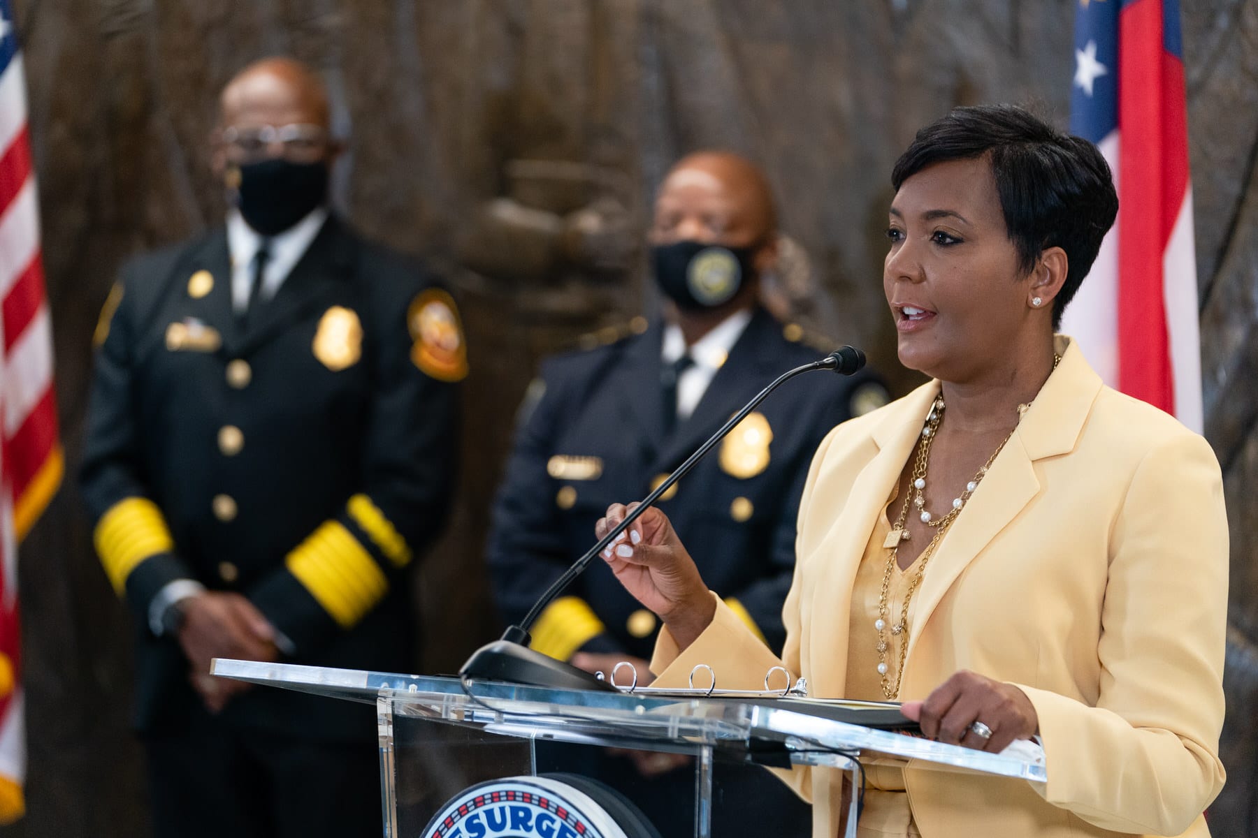 Atlanta Mayor Keisha Lance Bottoms speaks from a lectern at a news conference.