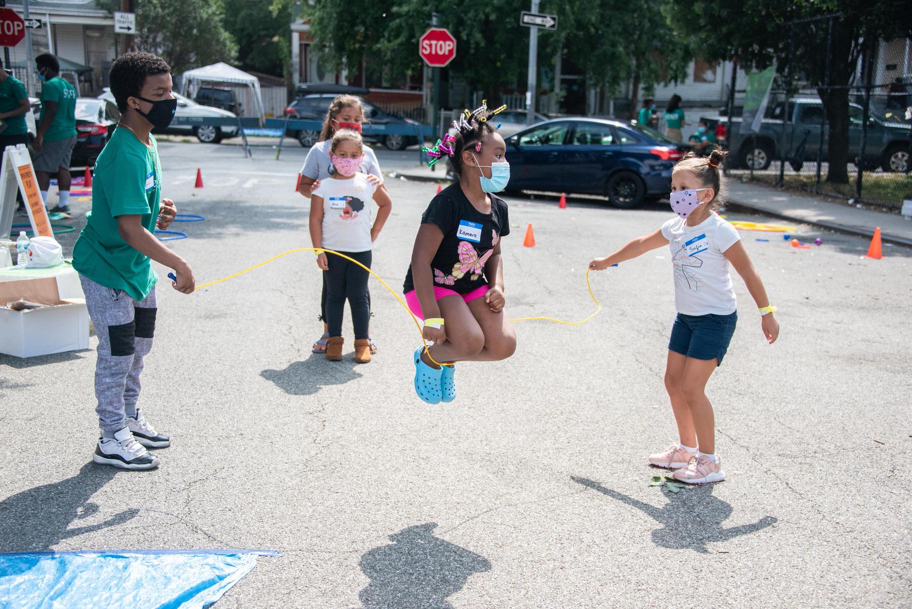 Kids skipping rope.