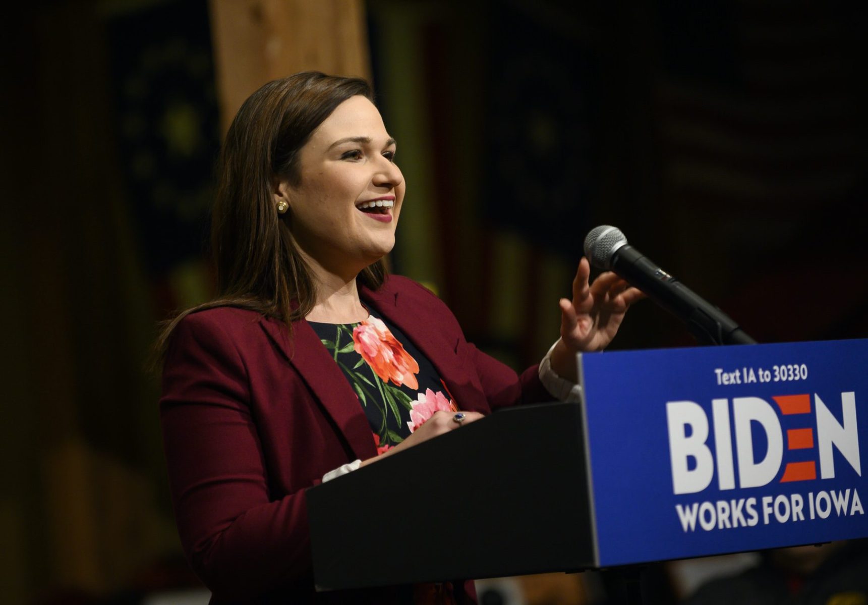 Abby Finkenauer speaking at a podium.