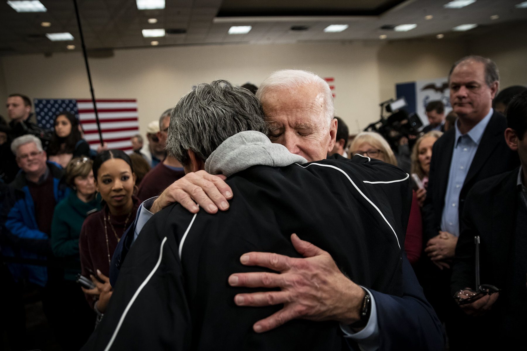 US President Joe Biden hugs an attendee during an event on January 21, 2020 in Ames, Iowa.