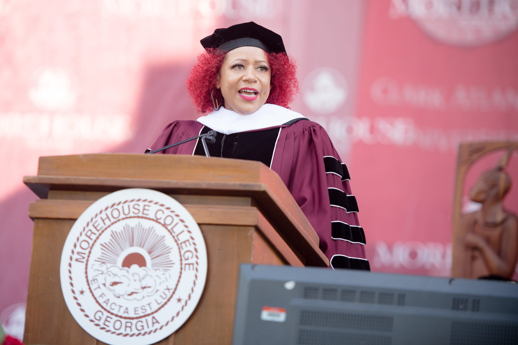 Nikole Hannah-Jones speaking at a podium.