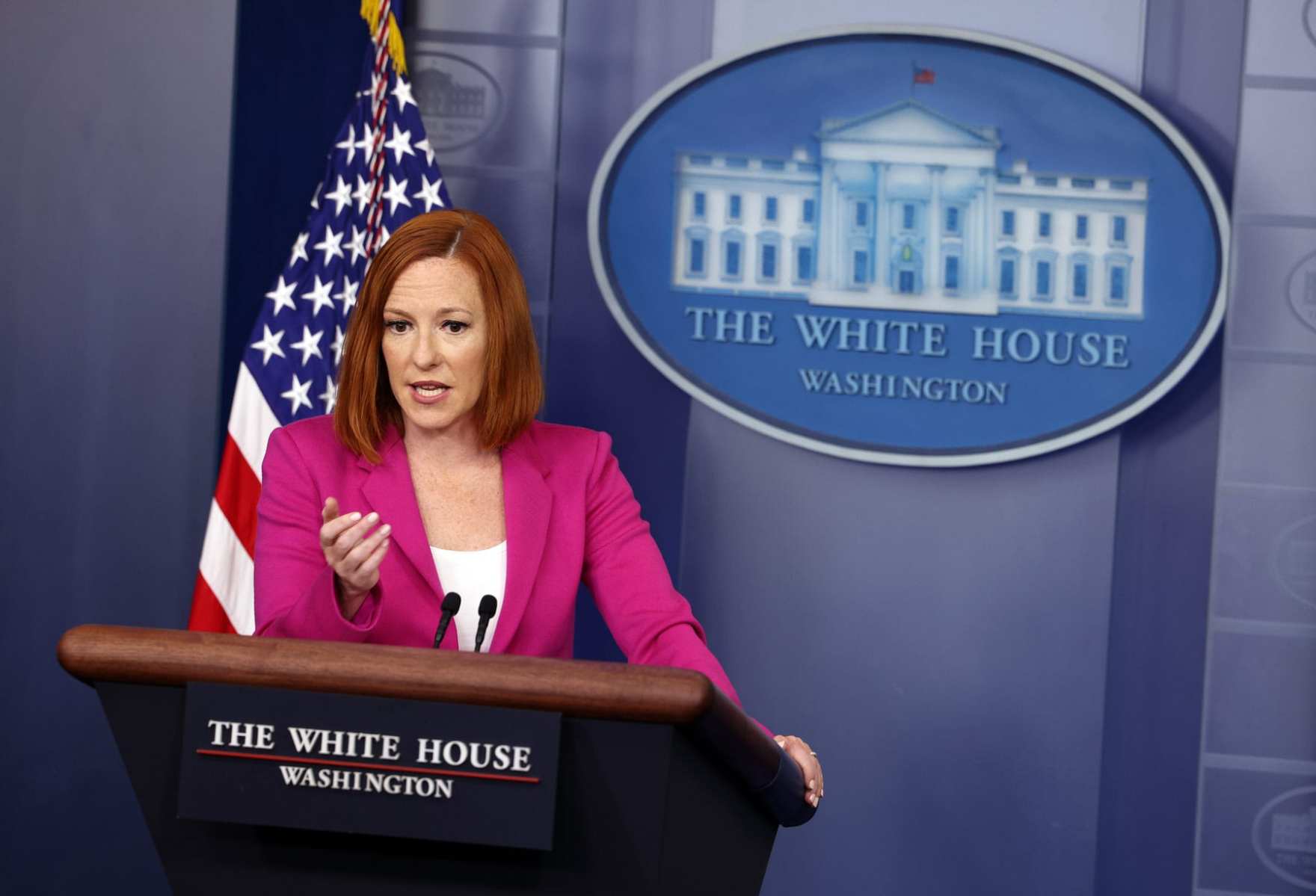 White House Press Secretary Jen Psaki stands at a podium.