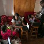 Syrita Powers and her family pictured at home in their living room.