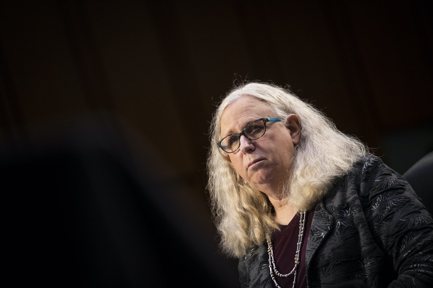 Dr. Rachel Levine against a dark background.