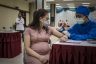 Pregnant woman gets vaccinated in Indonesia