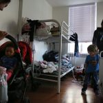 Photo of children and parents in a shelter.