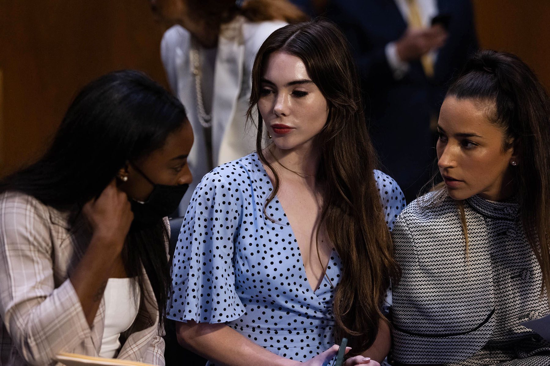 Simone Biles speaks to McKayla Maroney and Aly Raisman.