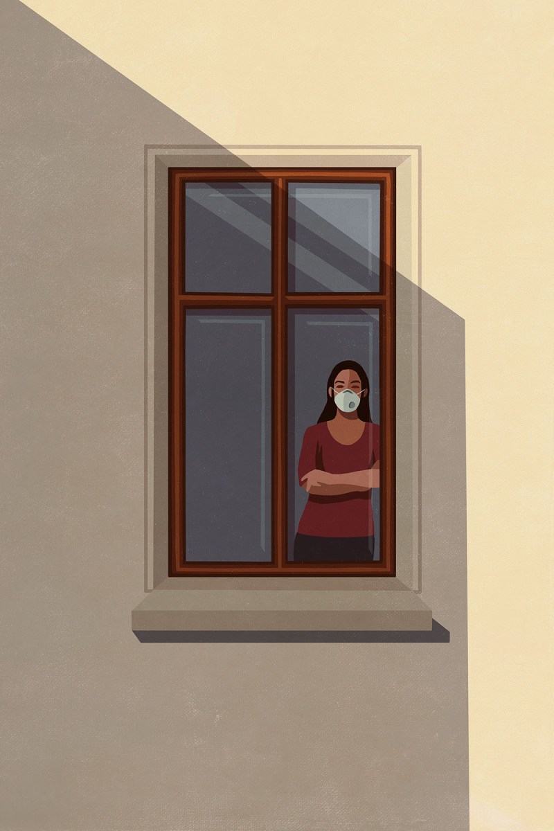 An illustration of a woman standing at a window wearing a face mask.