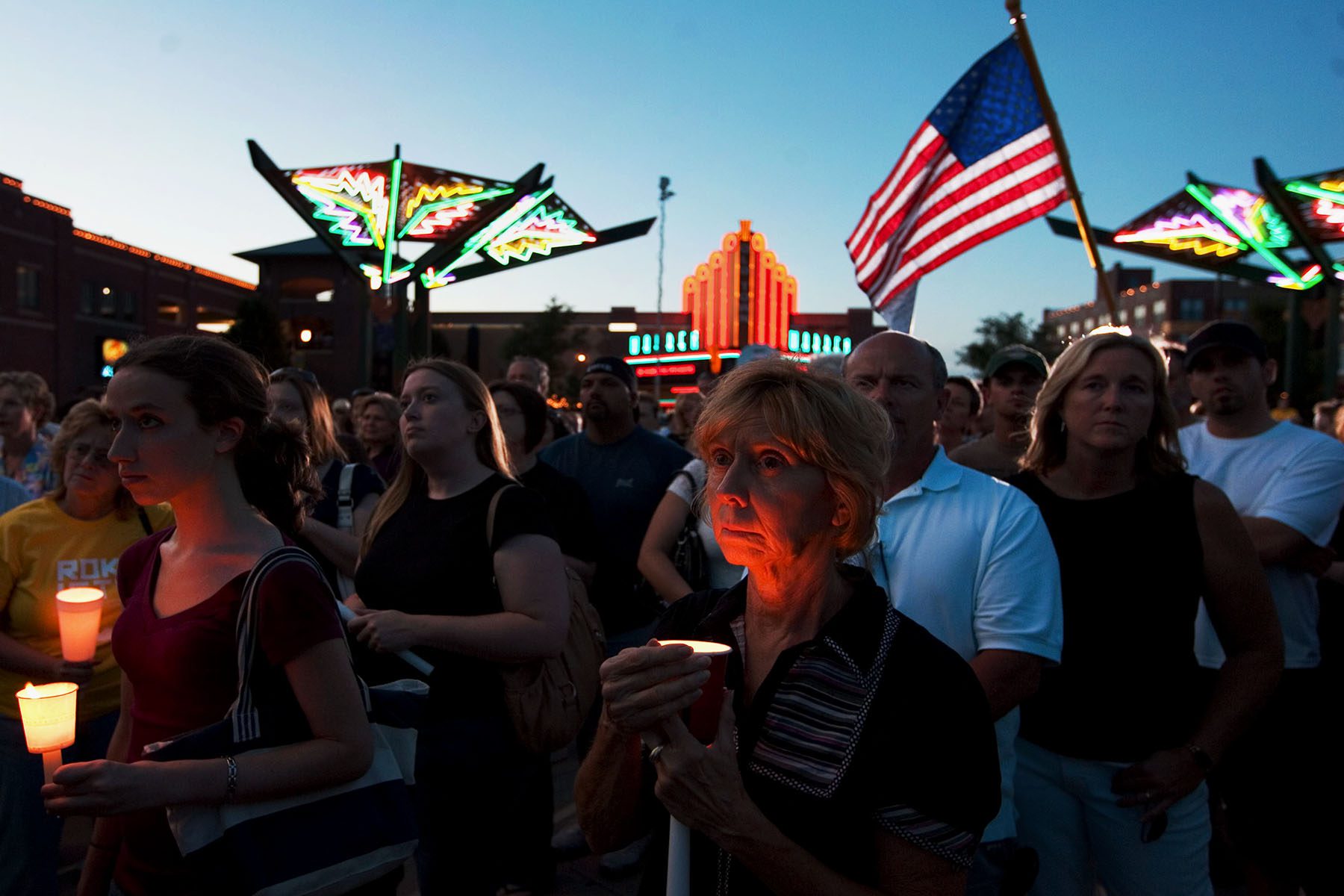 People participate in a candlelight vigil.