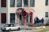 Law enforcement search the grounds outside the New Woman All Women Health Care clinic.