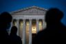 People gather to pay respects to Justice Ruth Bader Ginsburg in front of the Supreme Court.