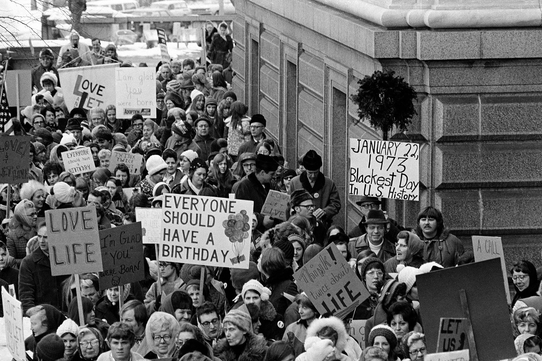 People protest around the Minnesota Capitol building.