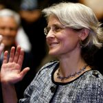 Beth Robinson raises her hand to take the oath of office.