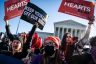 pro and anti-abortion rights activists gather outside the Supreme Court.