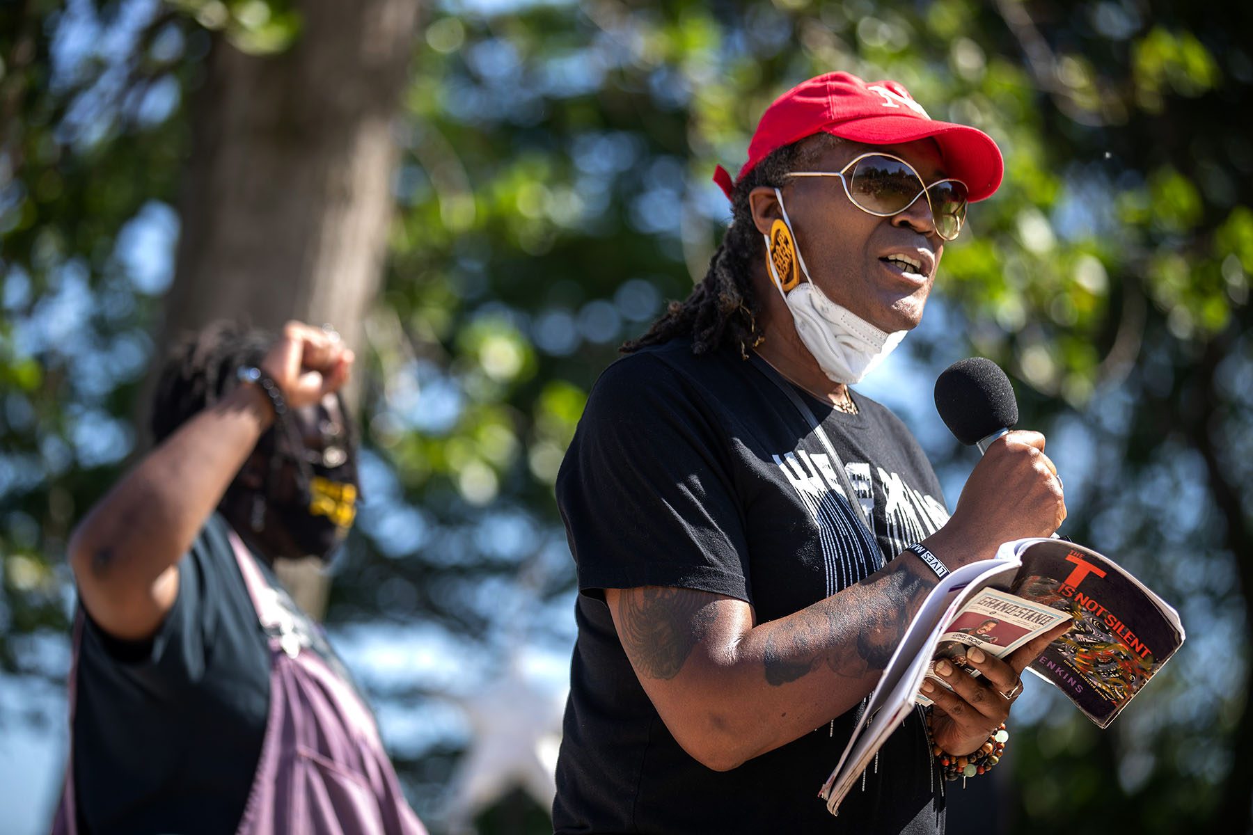 Andrea Jenkins speaks to community members at a park.