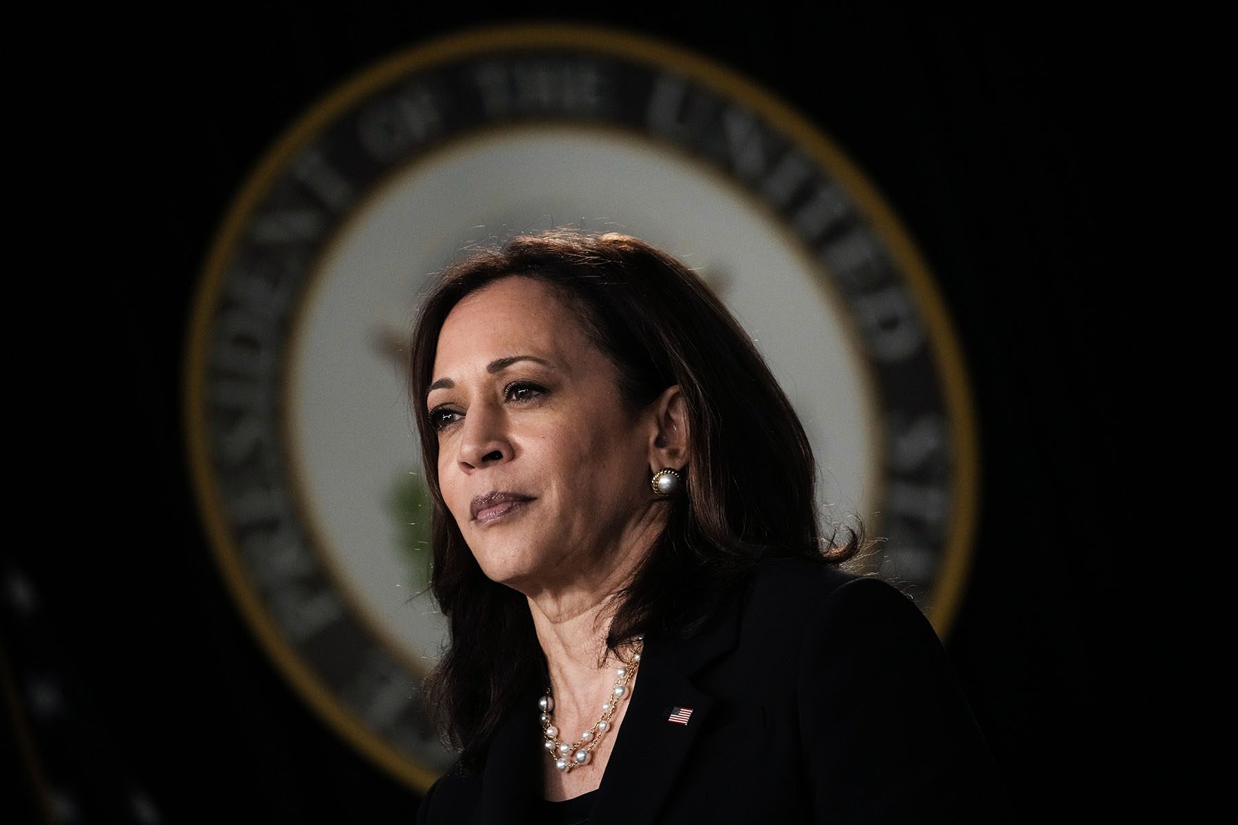 Kamala Harris waits to speak during an event.