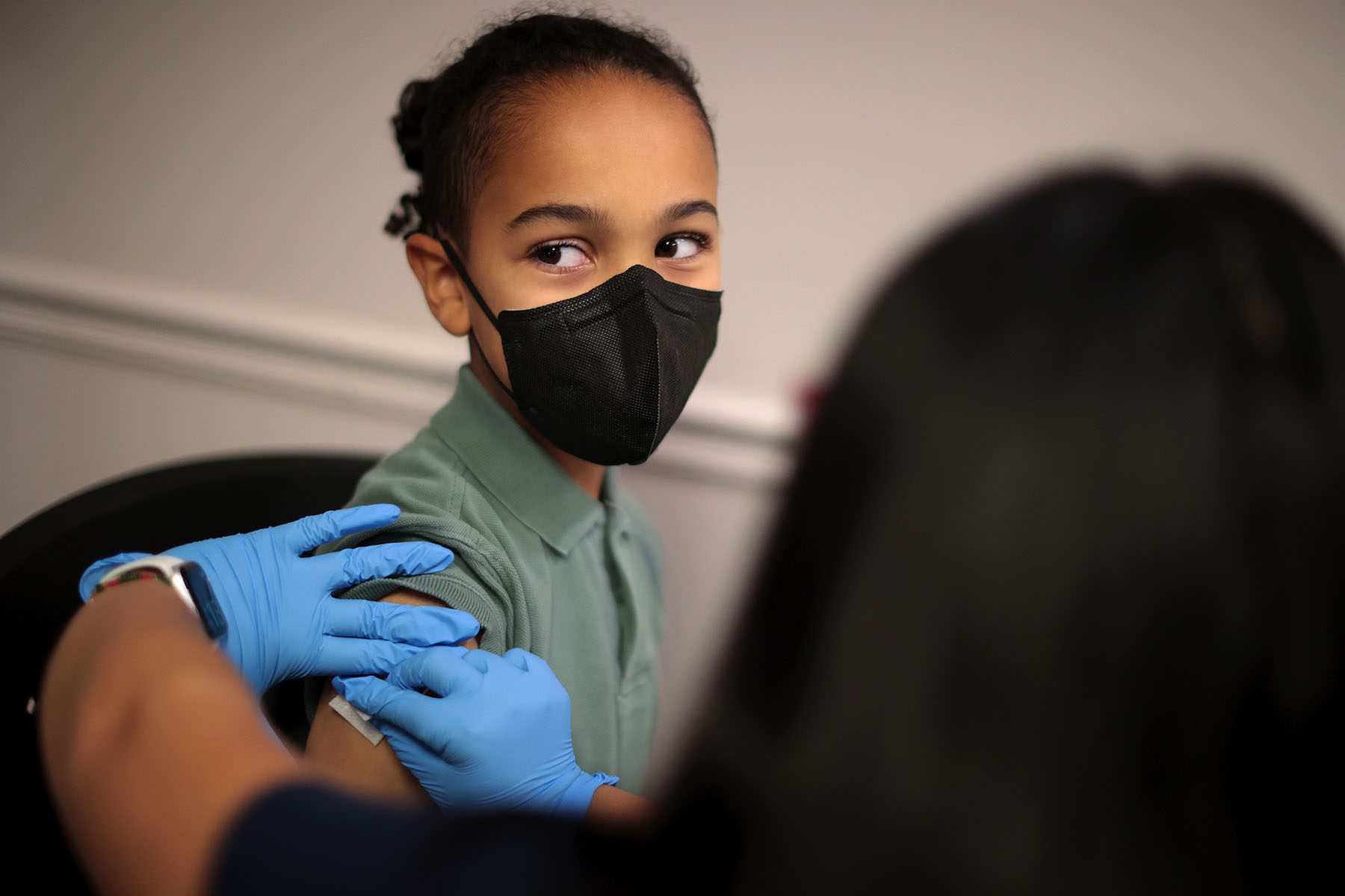 A child receives the Pfizer COVID-19 vaccine.