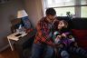 Steve Ammidown hangs out with his daughter June at home in Bowling Green, OH on December 9, 2021. Ammidown quit his job during the pandemic to take on child care and spend more time with his daughter.