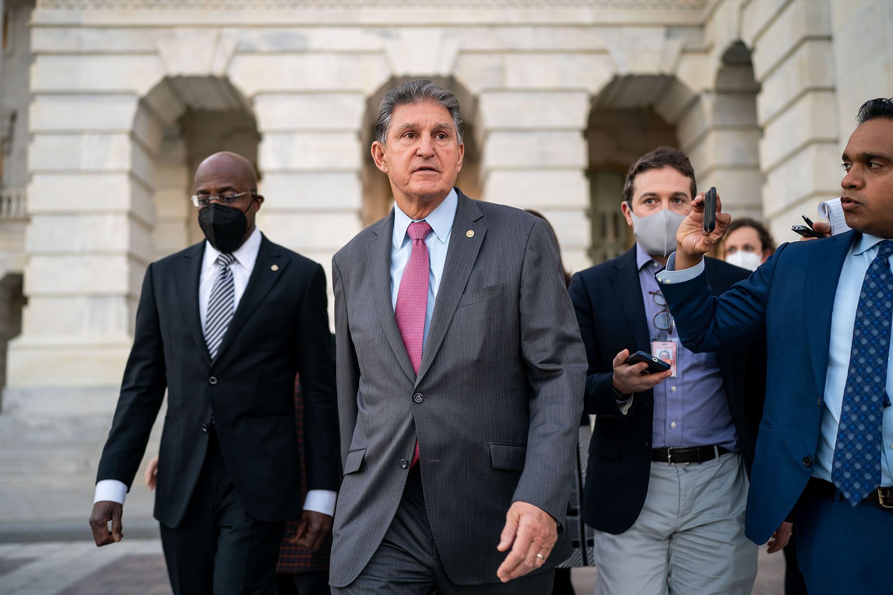 Sen. Joe Manchin talks to reporters on Capitol Hill.